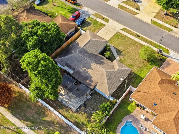 an aerial view of a house with a garden