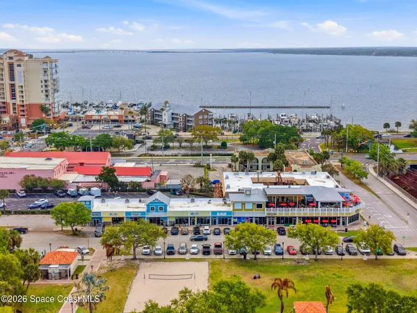 an aerial view of a residential houses with city street