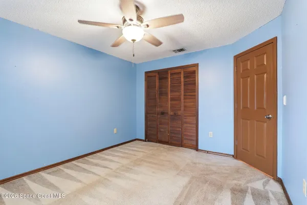 a view of a livingroom with a ceiling fan