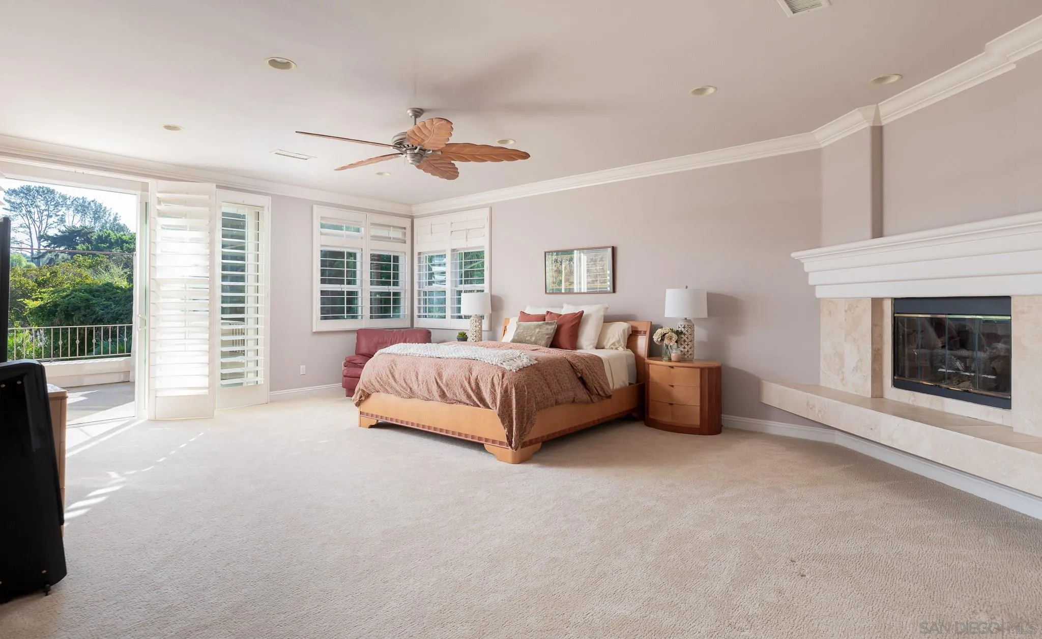 16319 Martincoit Road Poway, CA 92064 - Photo 13 of 29 a spacious bedroom with a large bed and a fireplace