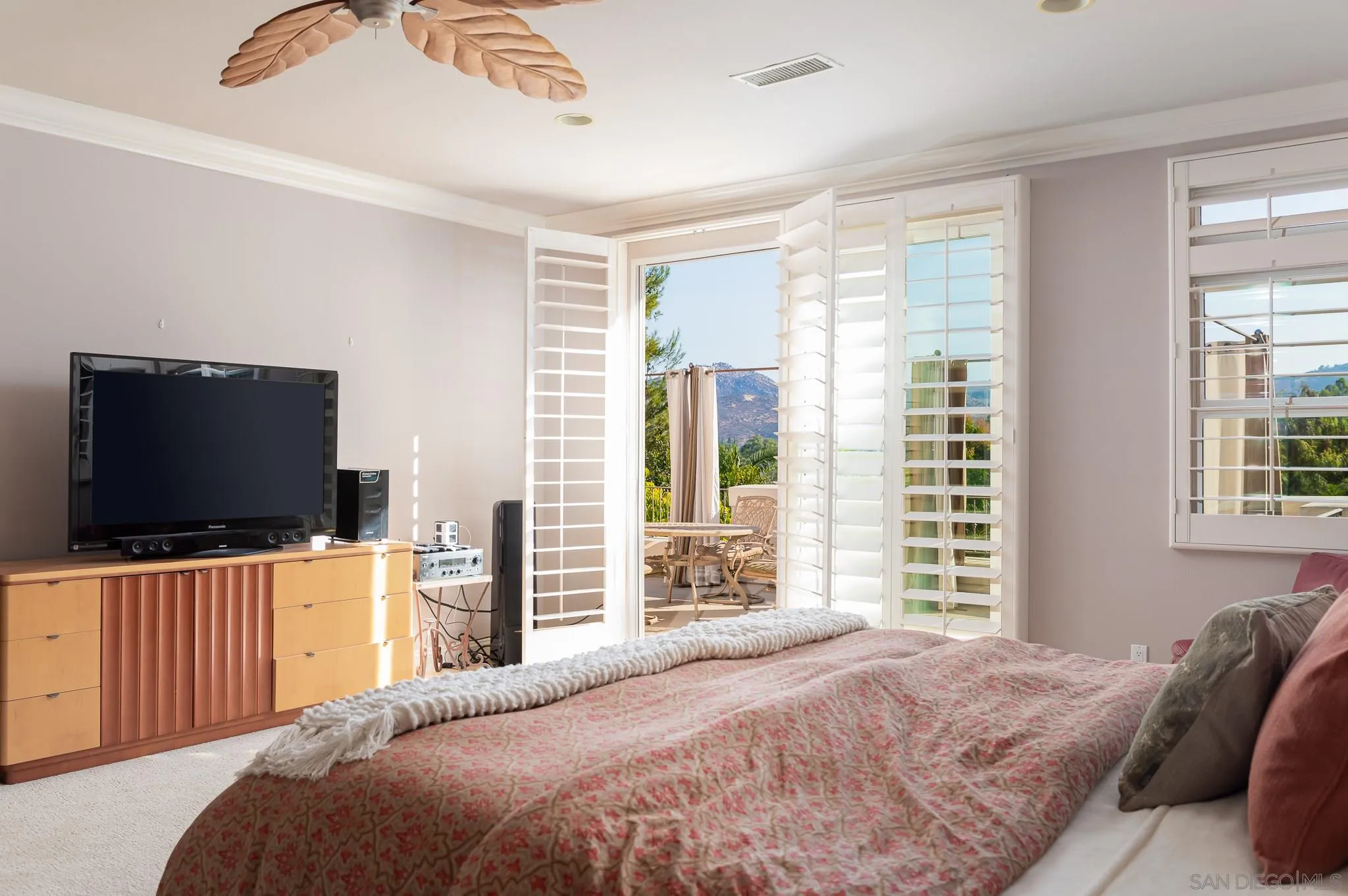 16319 Martincoit Road Poway, CA 92064 - Photo 14 of 29 a bedroom with a bed and a flat screen tv on dresser