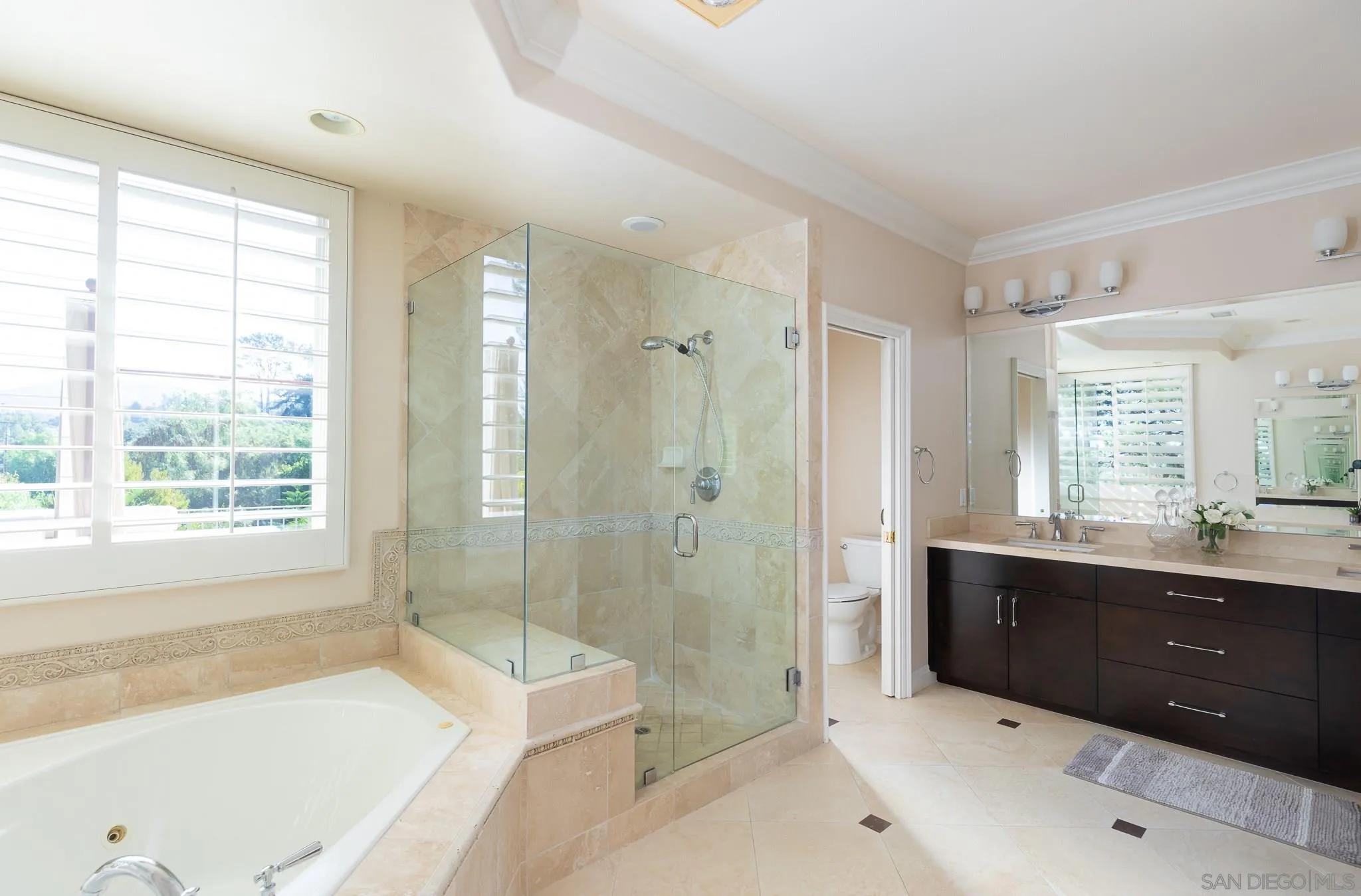 16319 Martincoit Road Poway, CA 92064 - Photo 16 of 29 a spacious bathroom with a tub sink shower and mirror