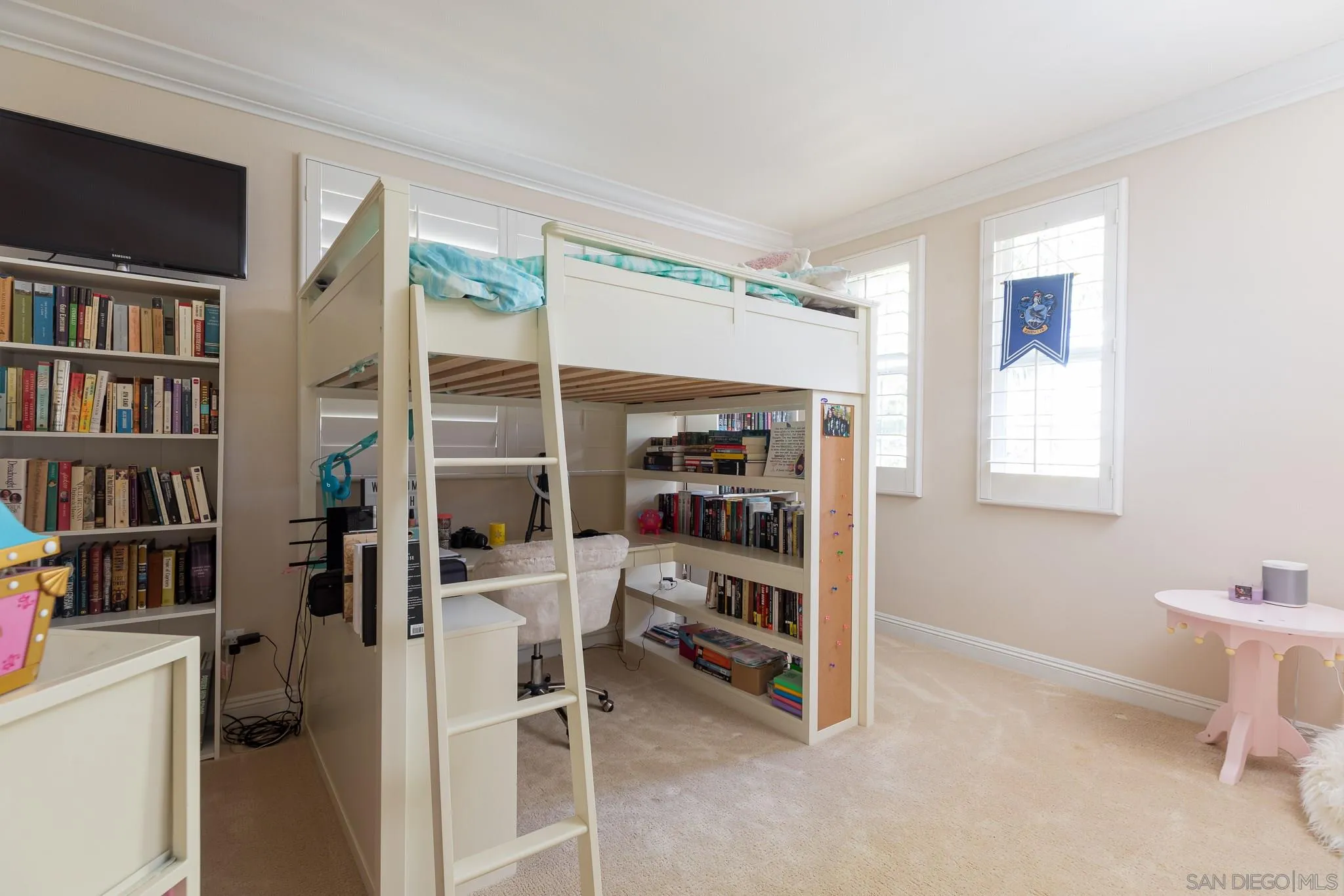 16319 Martincoit Road Poway, CA 92064 - Photo 18 of 29 a room with a book shelf and a window