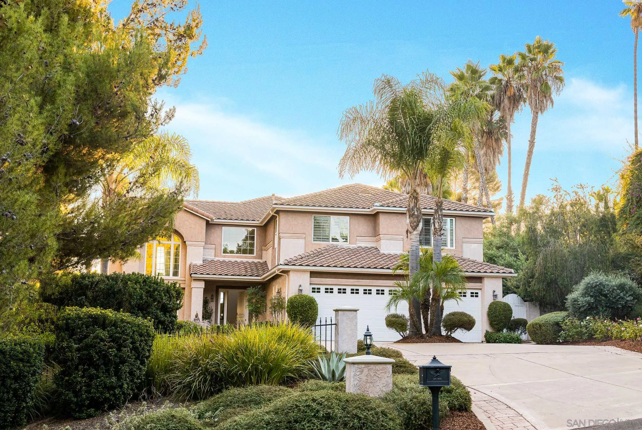 16319 Martincoit Road Poway, CA 92064 - Photo 2 of 29 a front view of a house with a garden