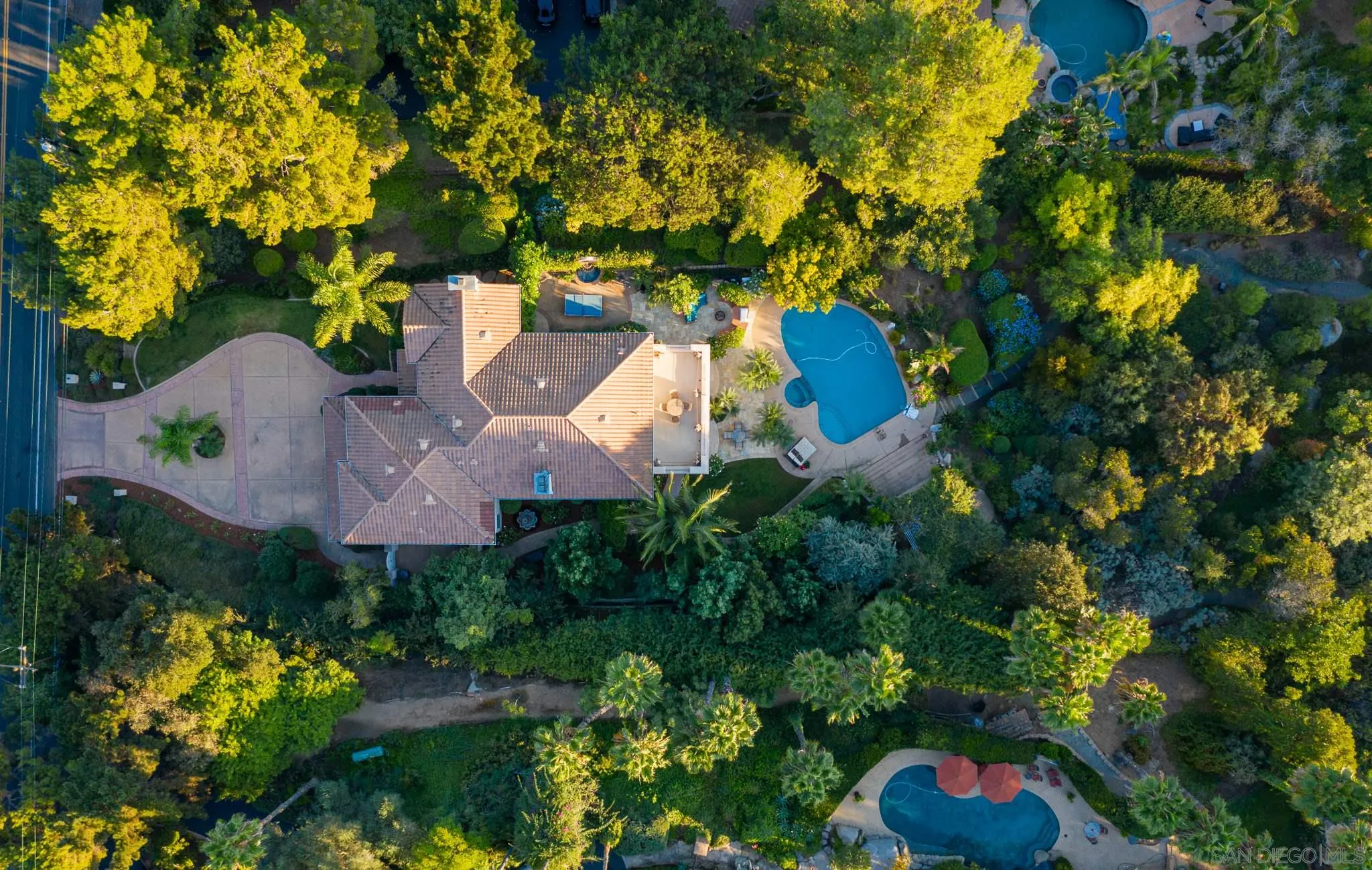 16319 Martincoit Road Poway, CA 92064 - Photo 23 of 29 an aerial view of a house with swimming pool and garden