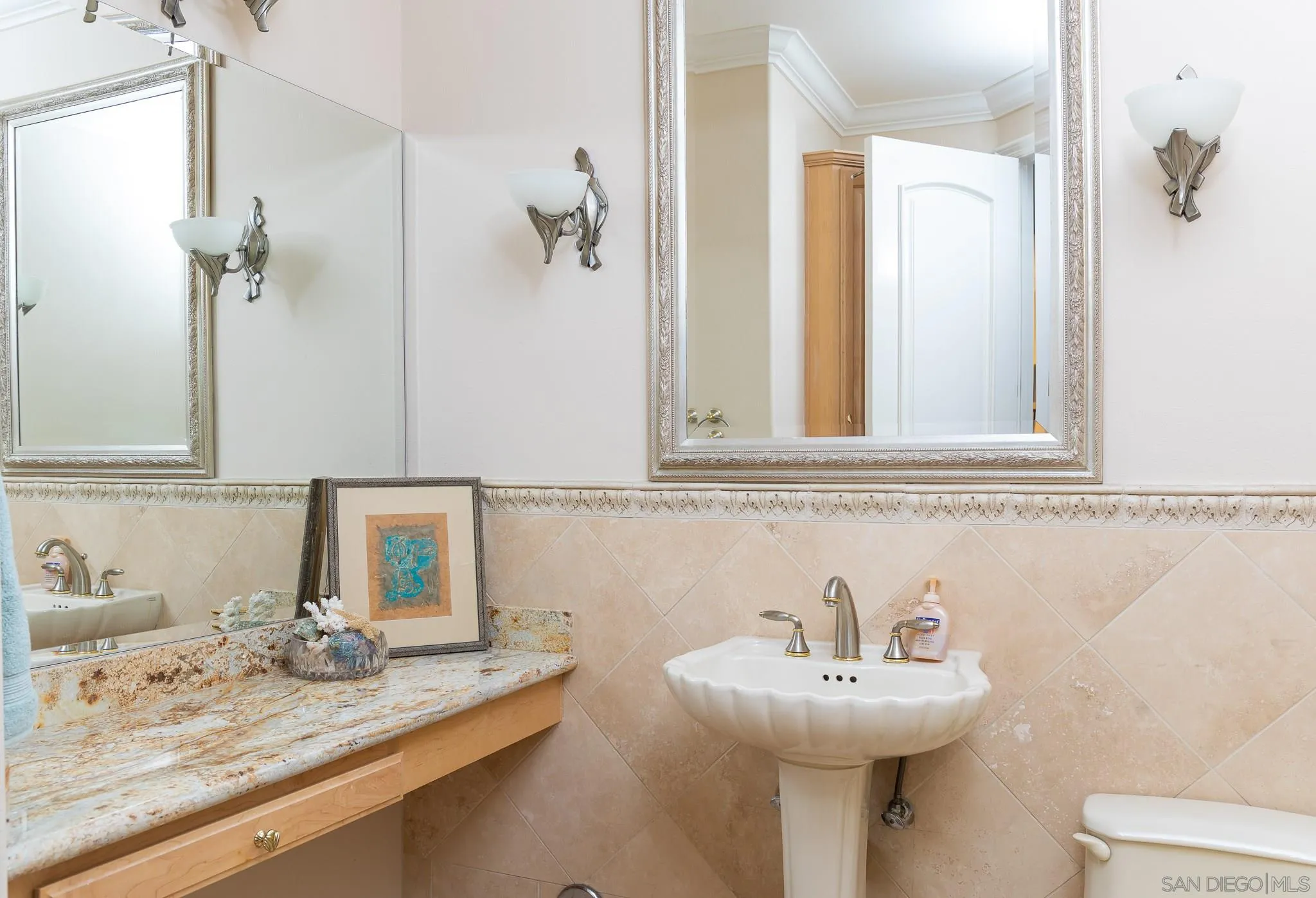 16319 Martincoit Road Poway, CA 92064 - Photo 10 of 29 a bathroom with a sink and a mirror