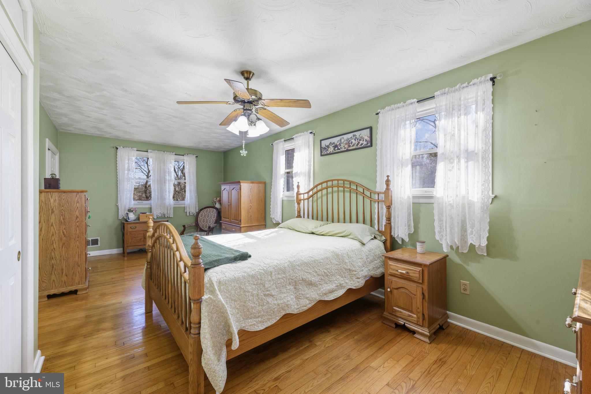 2019 Valley Road Annapolis, MD 21401 - Photo 14 of 42 a bedroom with a bed chandelier and a window