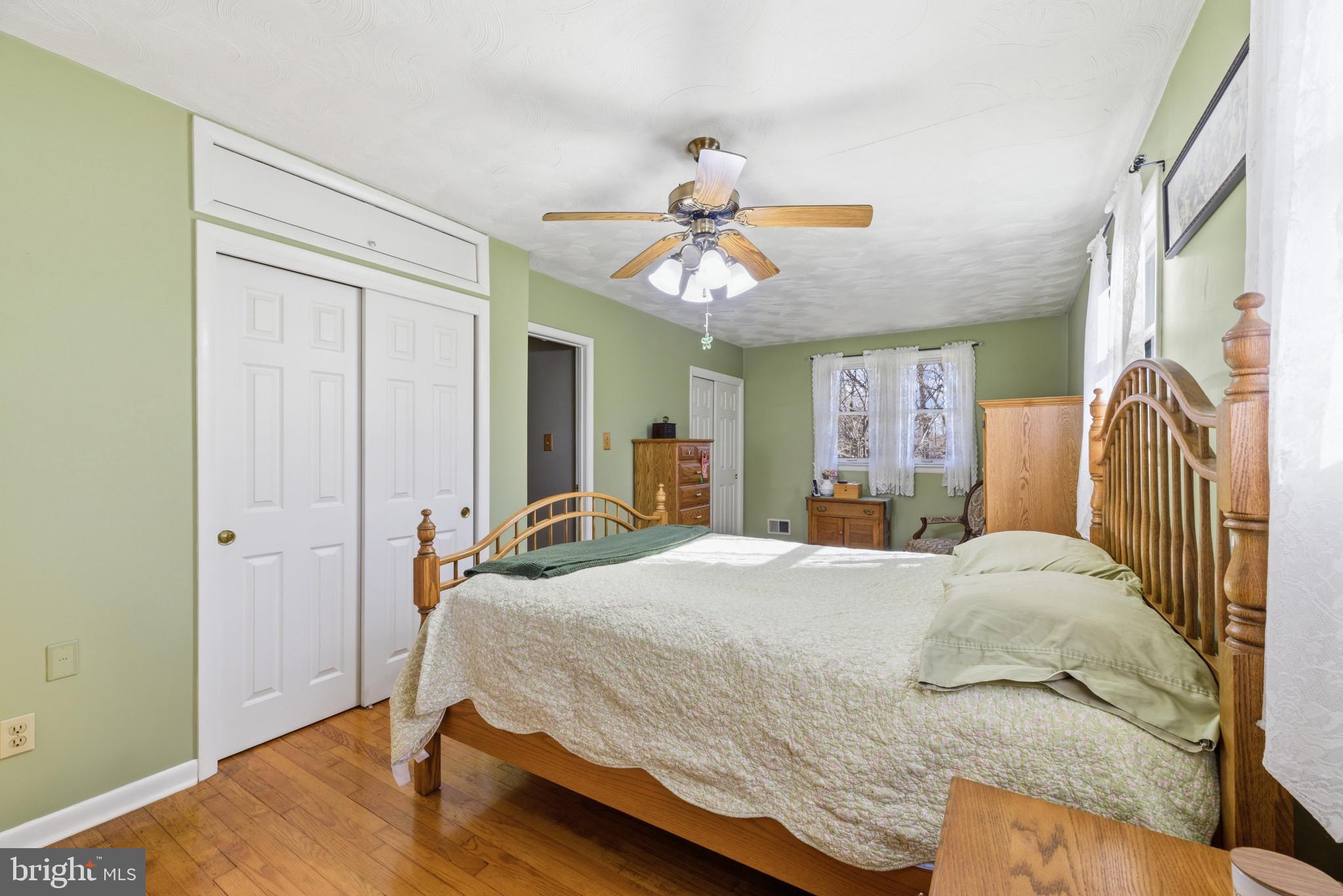 2019 Valley Road Annapolis, MD 21401 - Photo 15 of 42 a bedroom with a bed and a chandelier