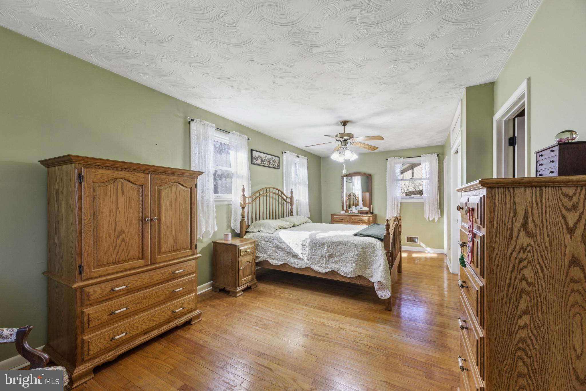 2019 Valley Road Annapolis, MD 21401 - Photo 16 of 42 a spacious bedroom with a bed and a dresser