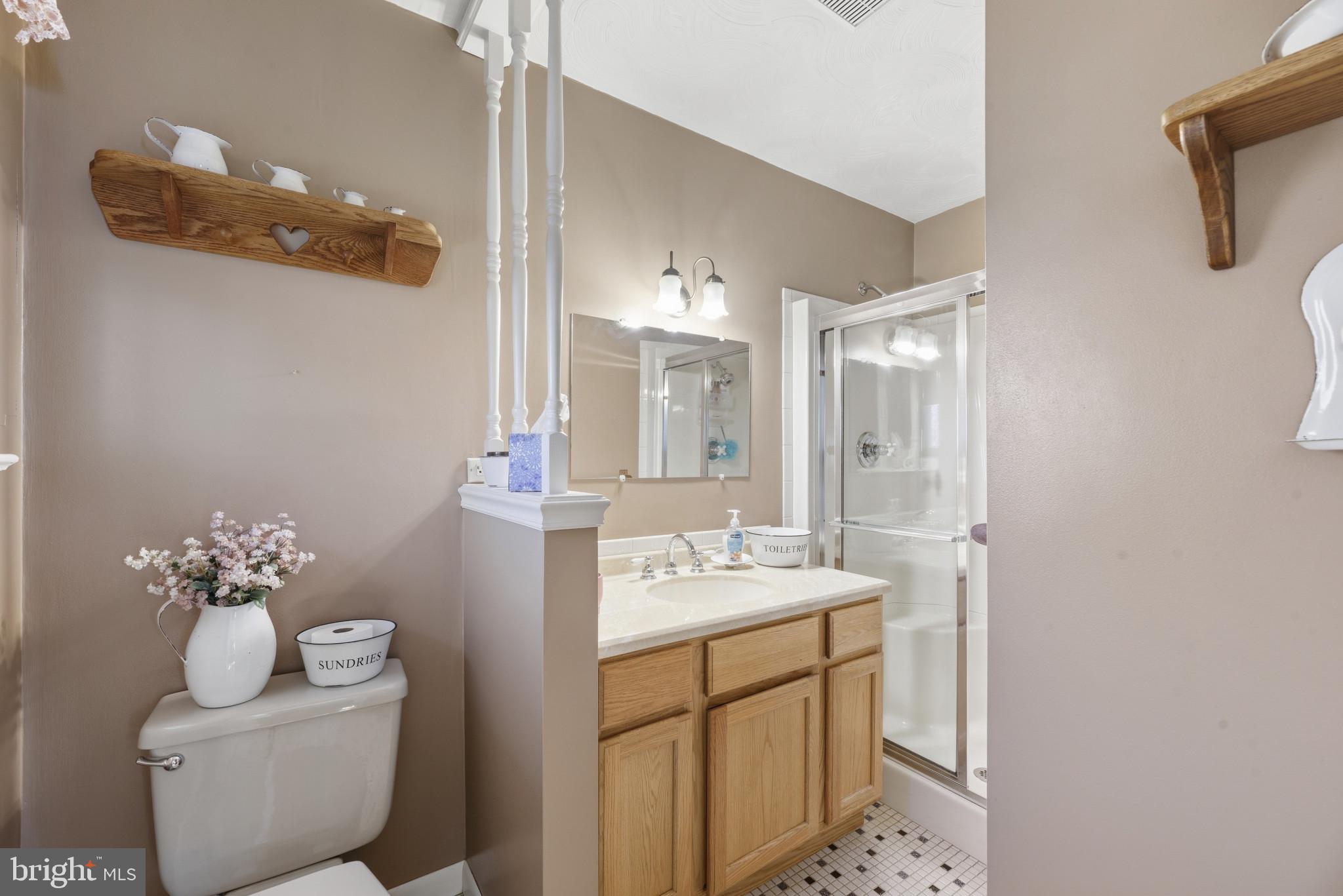 2019 Valley Road Annapolis, MD 21401 - Photo 17 of 42 a bathroom with a toilet sink and mirror