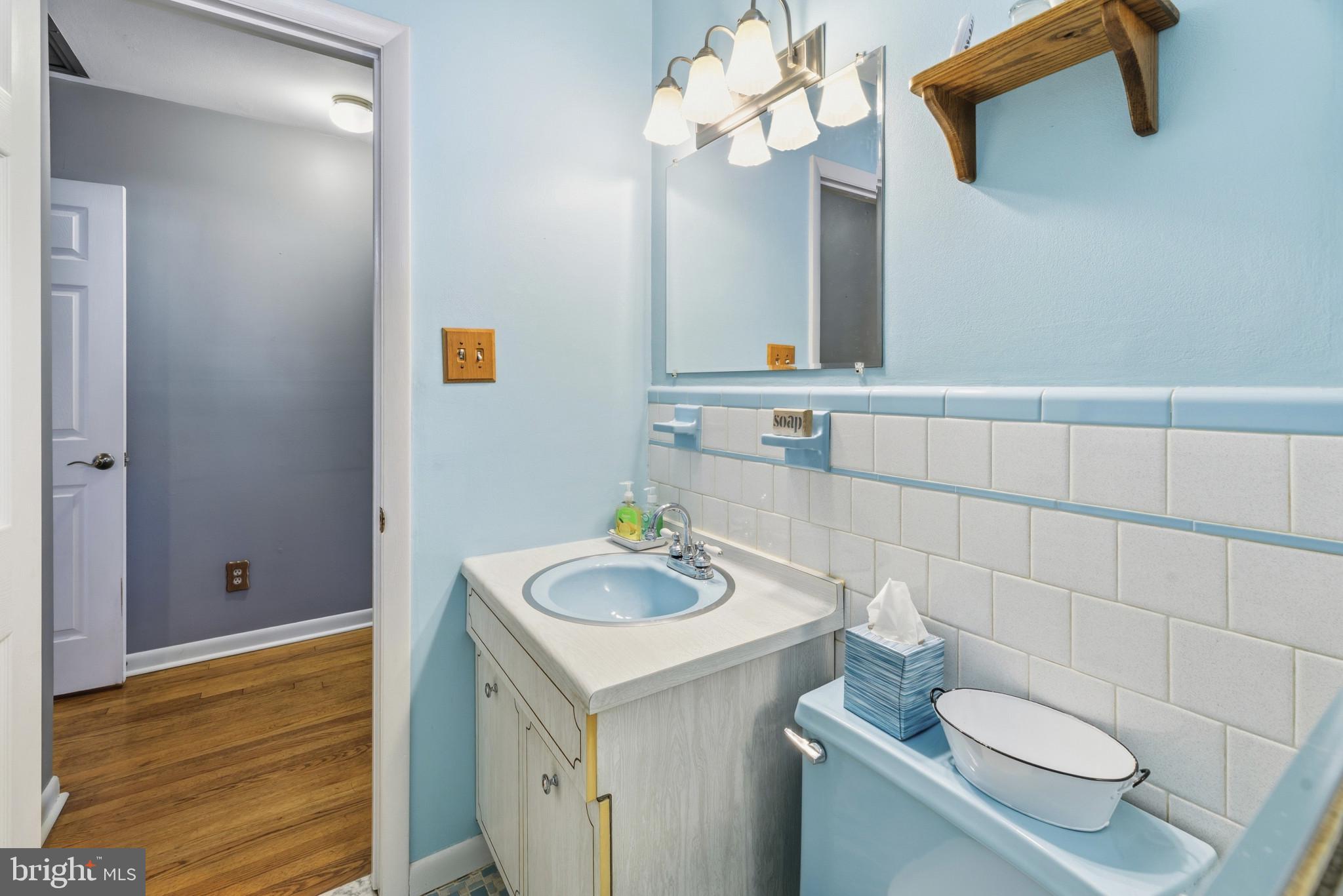 2019 Valley Road Annapolis, MD 21401 - Photo 22 of 42 a bathroom with a sink a toilet and mirror