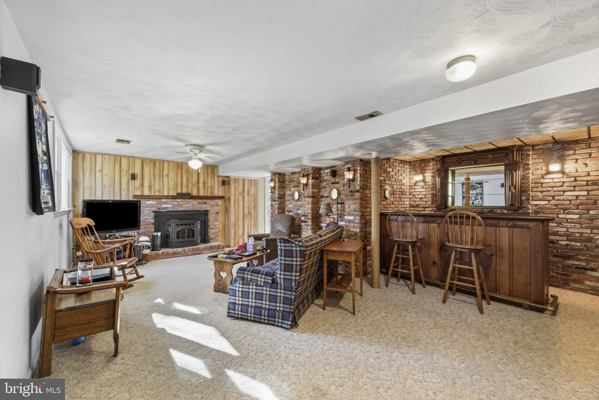 2019 Valley Road Annapolis, MD 21401 - Photo 23 of 42 a living room with furniture a fireplace and a flat screen tv