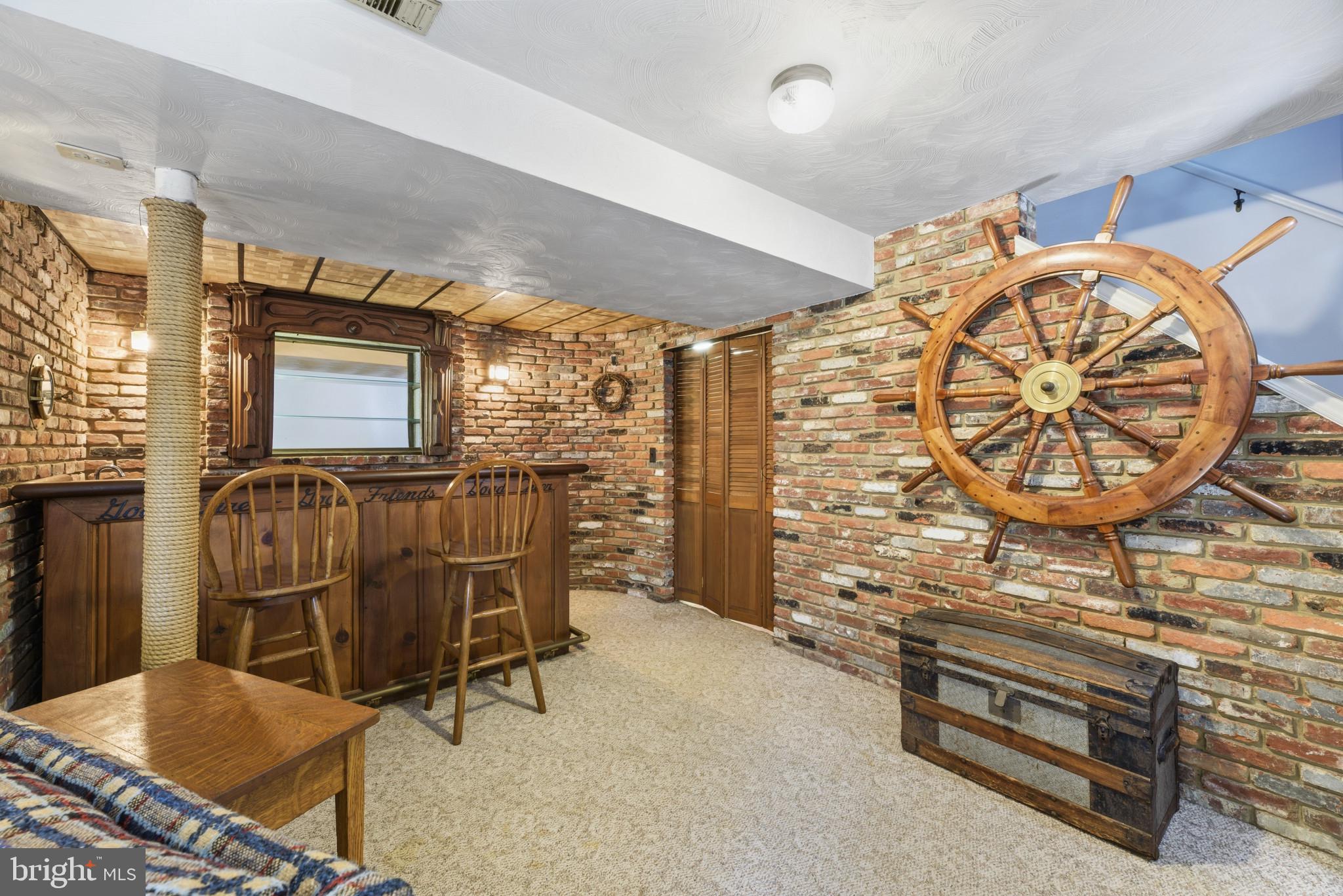 2019 Valley Road Annapolis, MD 21401 - Photo 26 of 42 a living room with furniture a flat screen tv and a wall