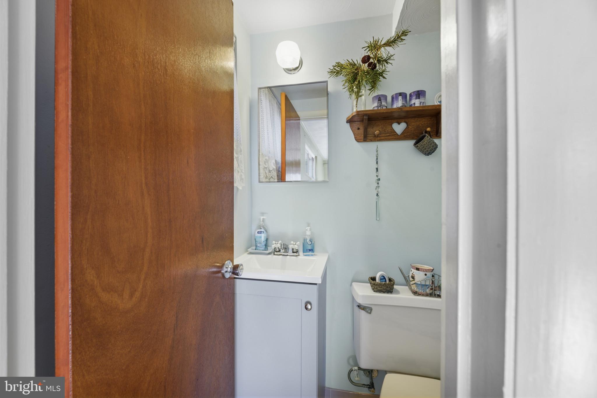2019 Valley Road Annapolis, MD 21401 - Photo 28 of 42 a bathroom with a sink toilet and mirror