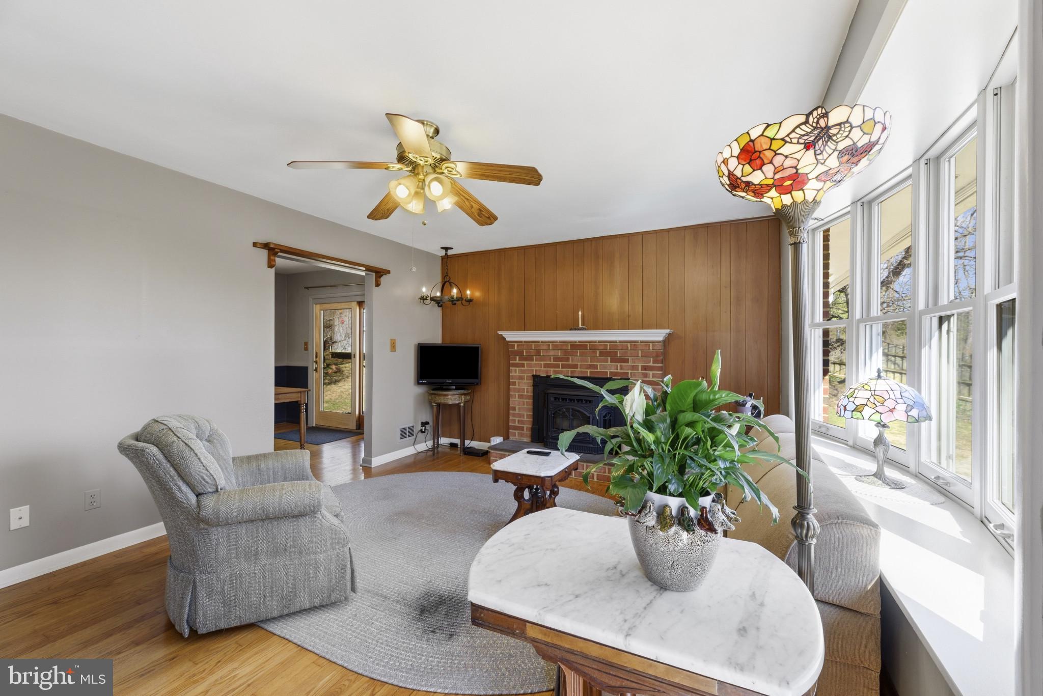 2019 Valley Road Annapolis, MD 21401 - Photo 4 of 42 a living room with furniture potted plant and a fireplace