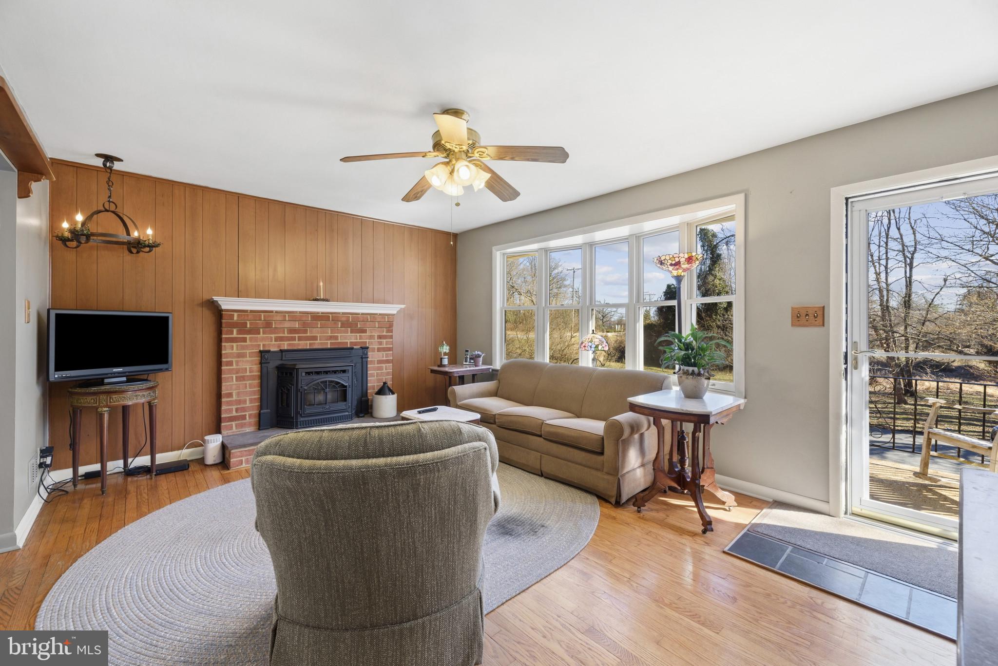 2019 Valley Road Annapolis, MD 21401 - Photo 5 of 42 a living room with furniture a flat screen tv and a fireplace