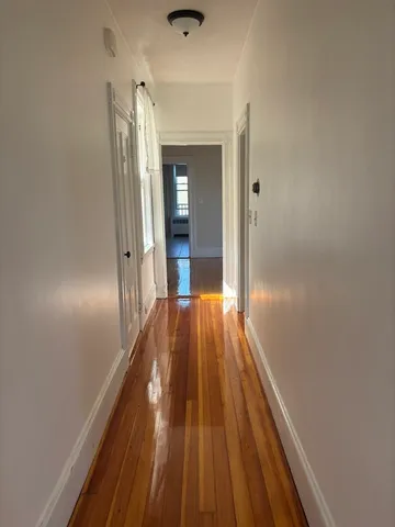 a view of gallery with wooden floor
