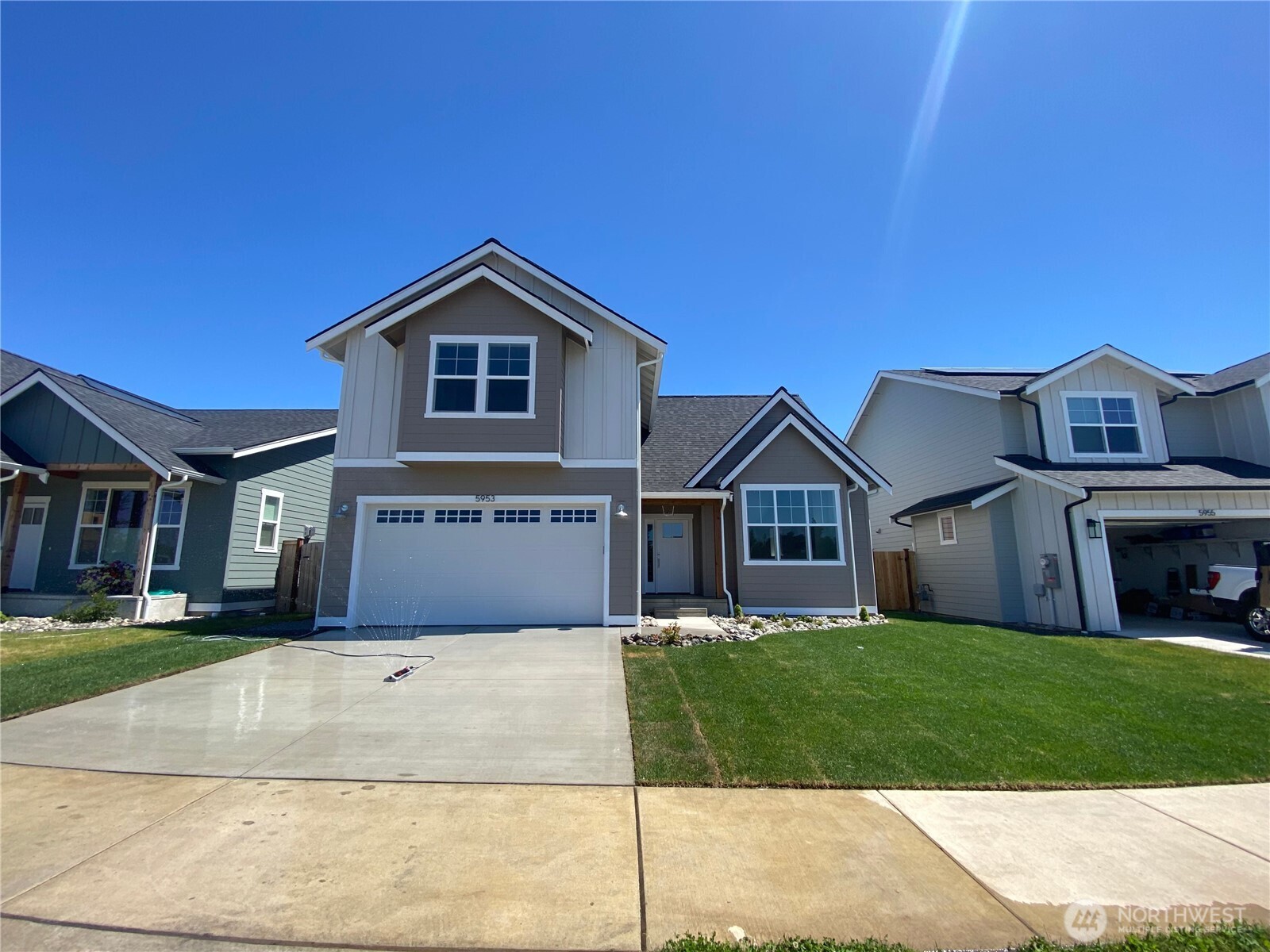 5953 (lot 64) Ranch Loop Ferndale, WA 98248 - Photo 1 of 38 a front view of a house with a yard and garage