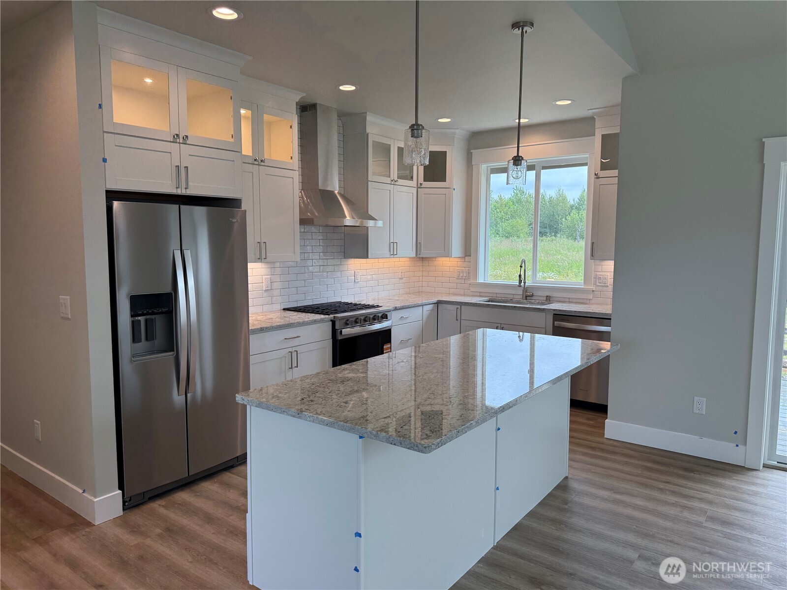 5953 (lot 64) Ranch Loop Ferndale, WA 98248 - Photo 11 of 38 a kitchen with stainless steel appliances granite countertop a refrigerator a sink and a stove