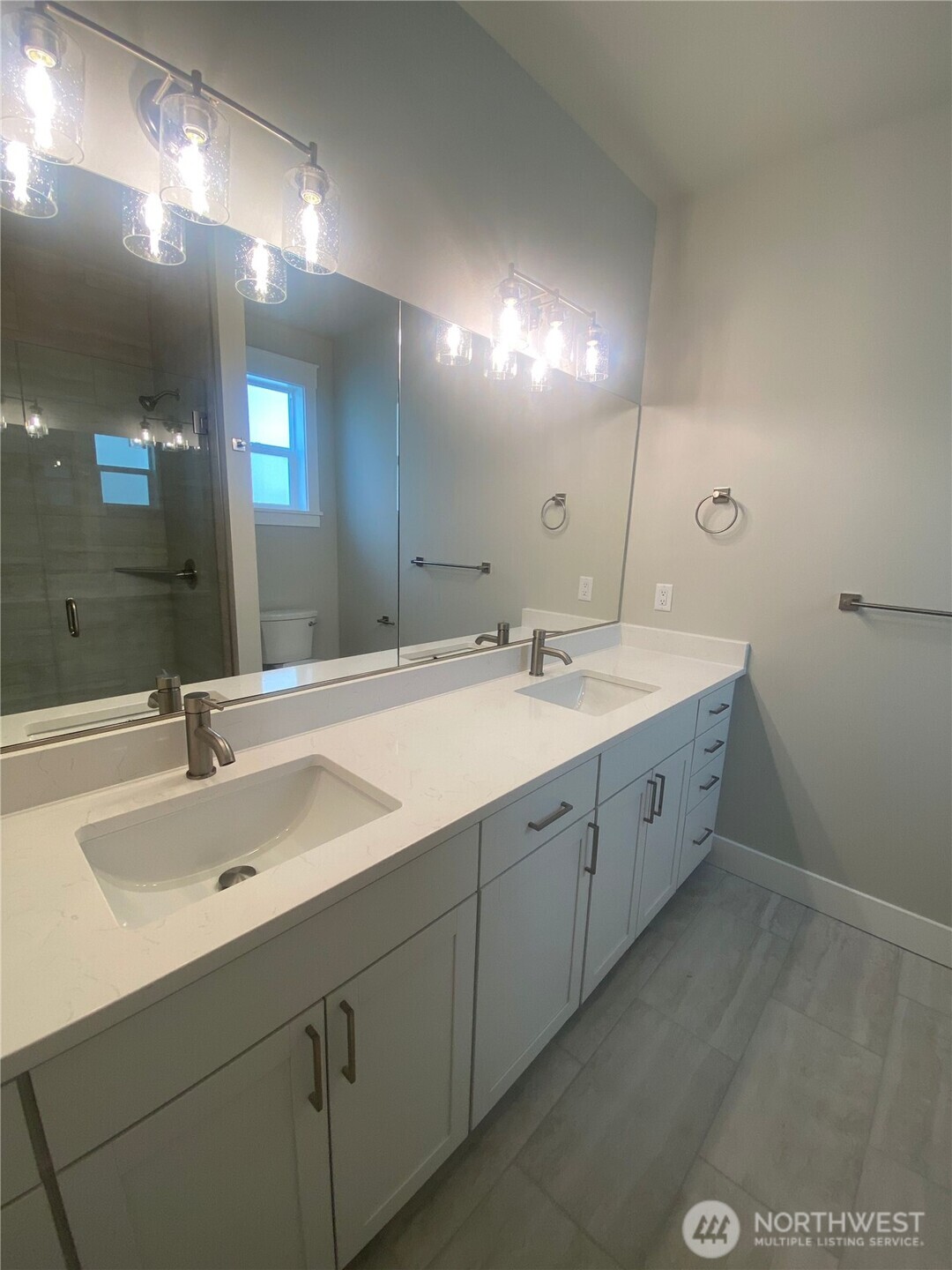 5953 (lot 64) Ranch Loop Ferndale, WA 98248 - Photo 16 of 38 a spacious bathroom with a double vanity sink and a mirror