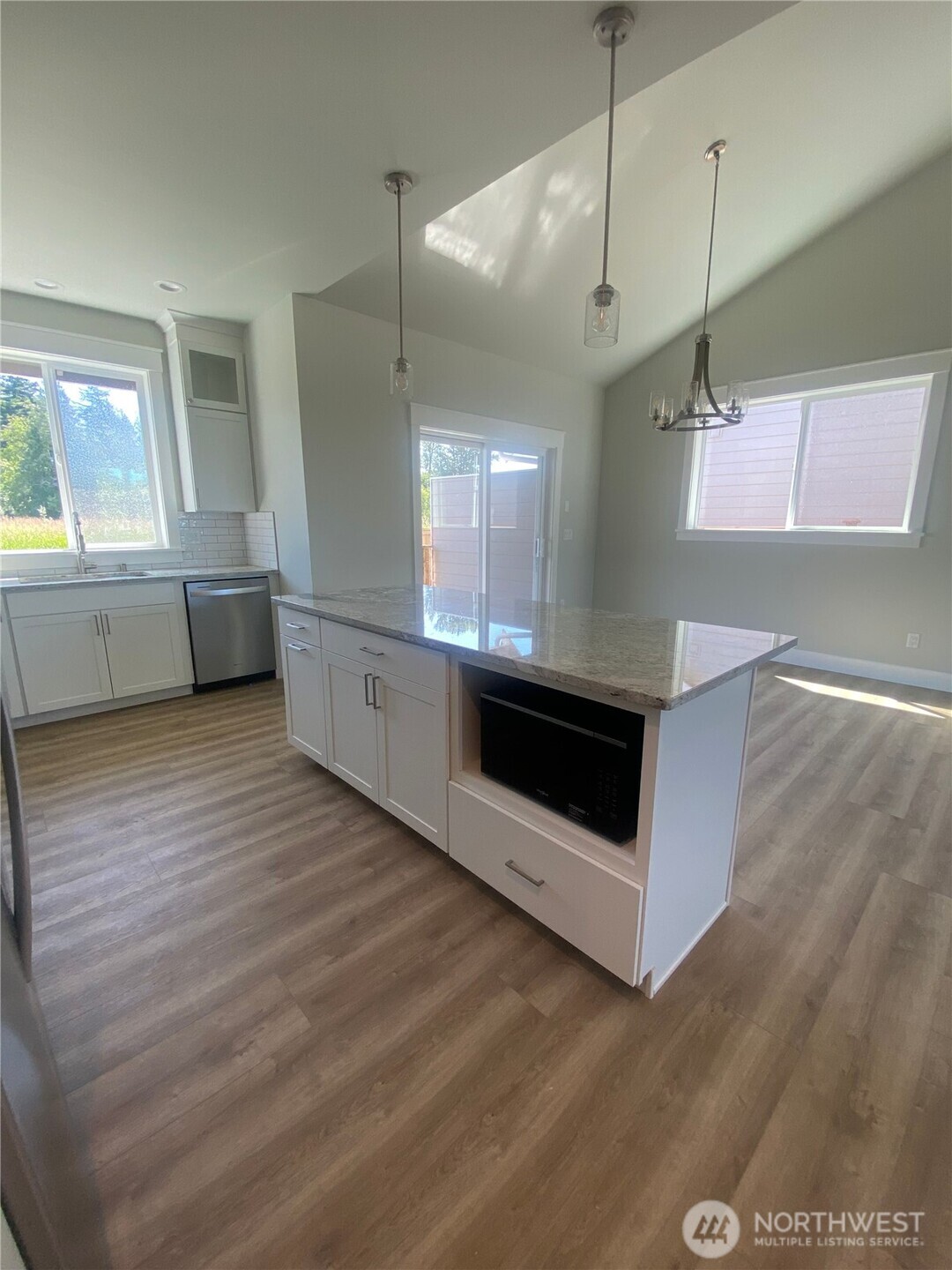 5953 (lot 64) Ranch Loop Ferndale, WA 98248 - Photo 23 of 38 a kitchen with stainless steel appliances wooden cabinets and a wooden floor