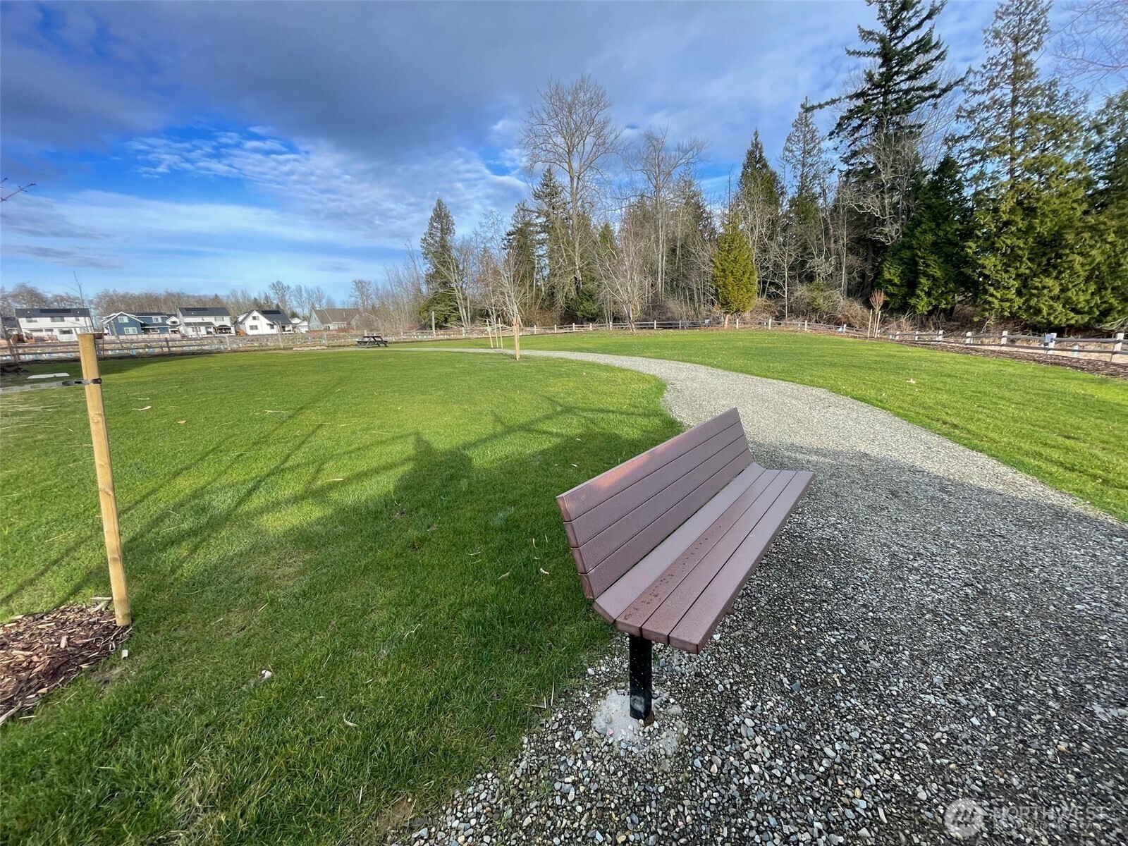 5953 (lot 64) Ranch Loop Ferndale, WA 98248 - Photo 38 of 38 a view of a garden with a bench in a park