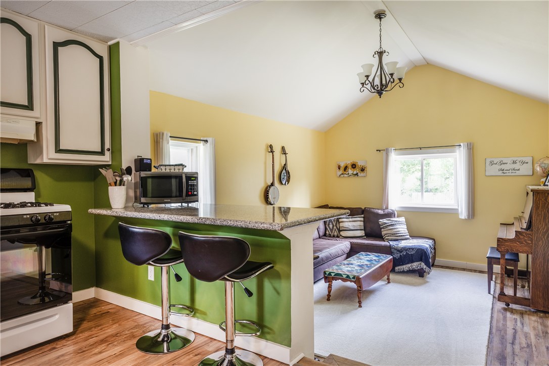 5885 County Road 11 Alpine, NY 14805 - Photo 16 of 37 Step down into the super spacious family room off