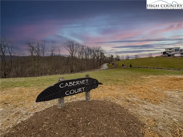 a street sign on a brick wall