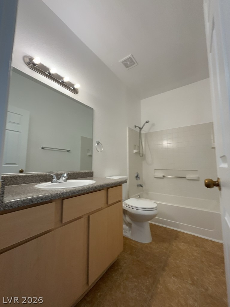 4915 East Russell Road, Unit 151 Las Vegas, NV 89120 - Photo 5 of 9 This second floor, full bathroom features a wooden vanity with laminate counters and a tub-shower combination.