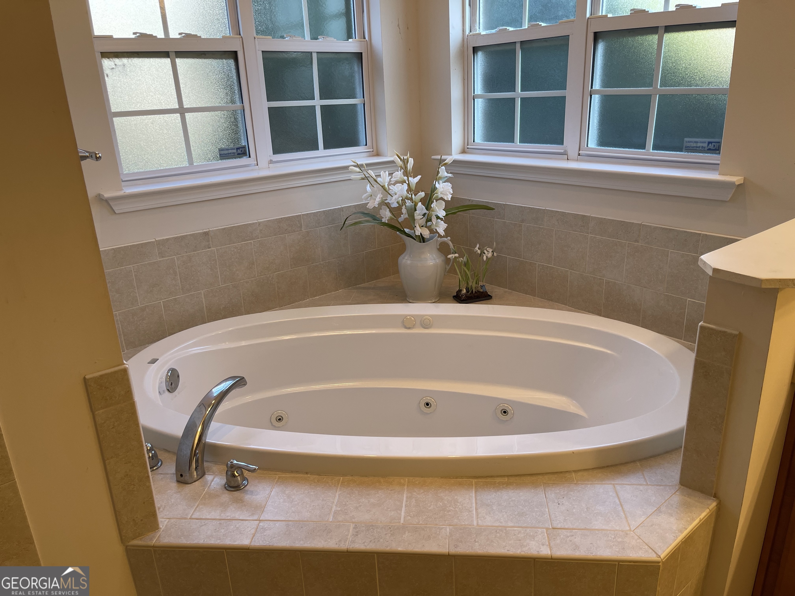 137 Blue Ridge Drive Statesboro, GA 30458 - Photo 15 of 26 a white bath tub sitting next to a window