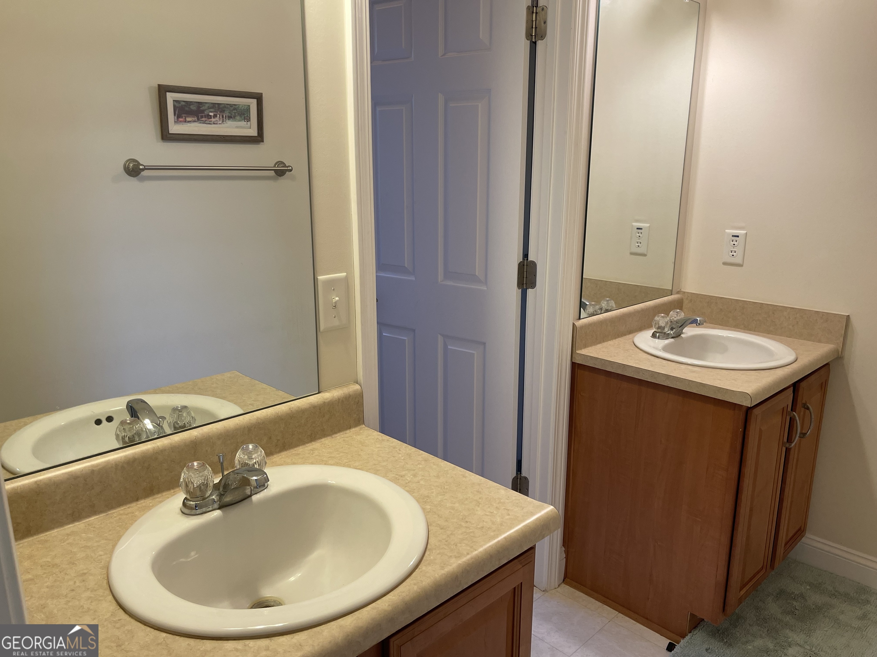 137 Blue Ridge Drive Statesboro, GA 30458 - Photo 19 of 26 a bathroom with a sink and a mirror