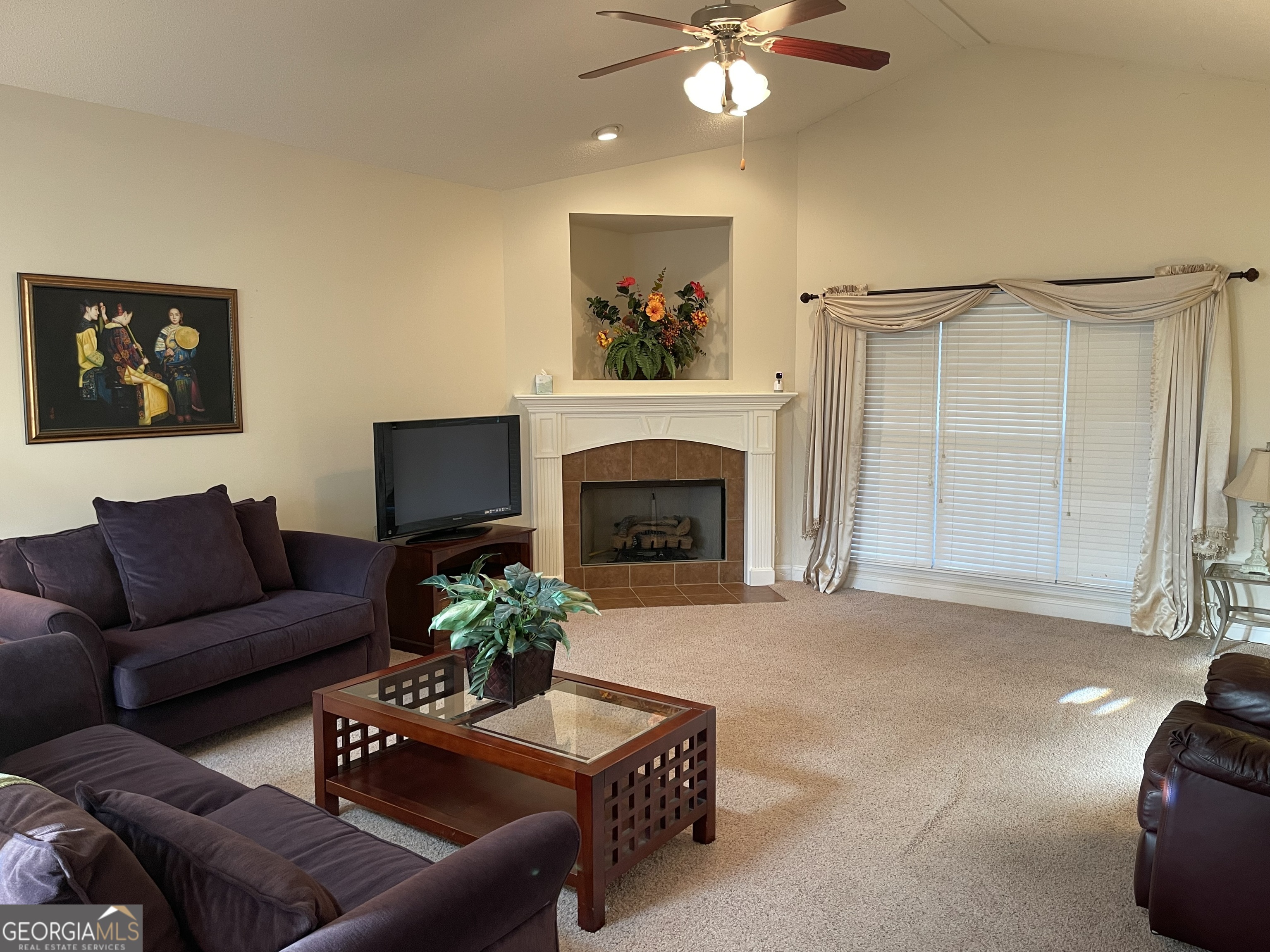 137 Blue Ridge Drive Statesboro, GA 30458 - Photo 2 of 26 a living room with furniture and a fireplace