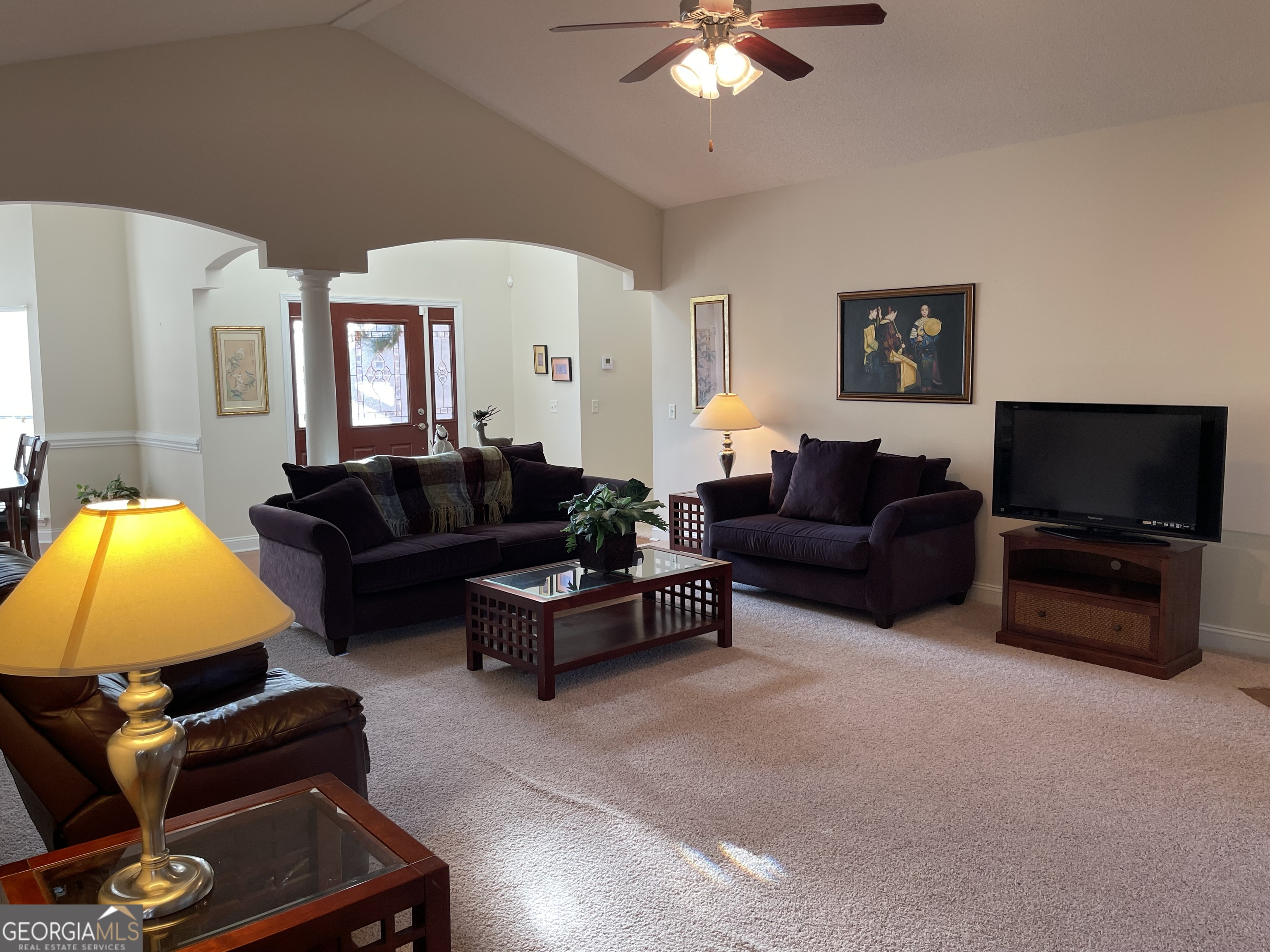 137 Blue Ridge Drive Statesboro, GA 30458 - Photo 3 of 26 a living room with furniture a flat screen tv and a lamp