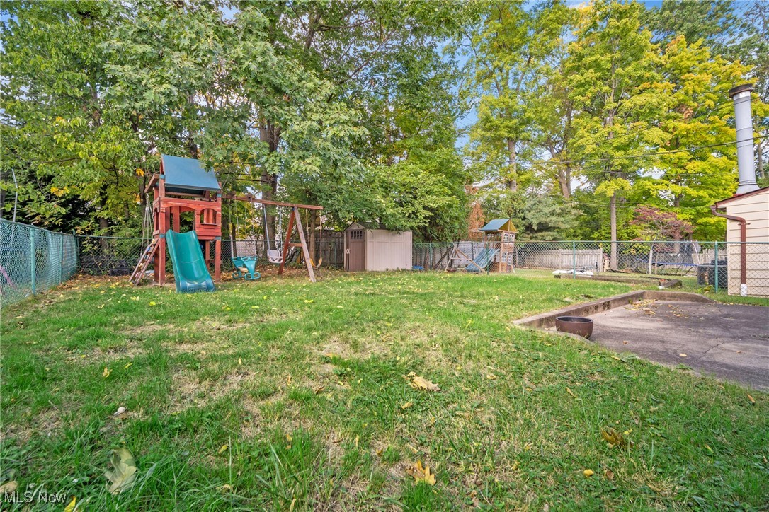 2440 White Road Cleveland, OH 44118 - Photo 43 of 43 View of yard with a playground and a storage shed