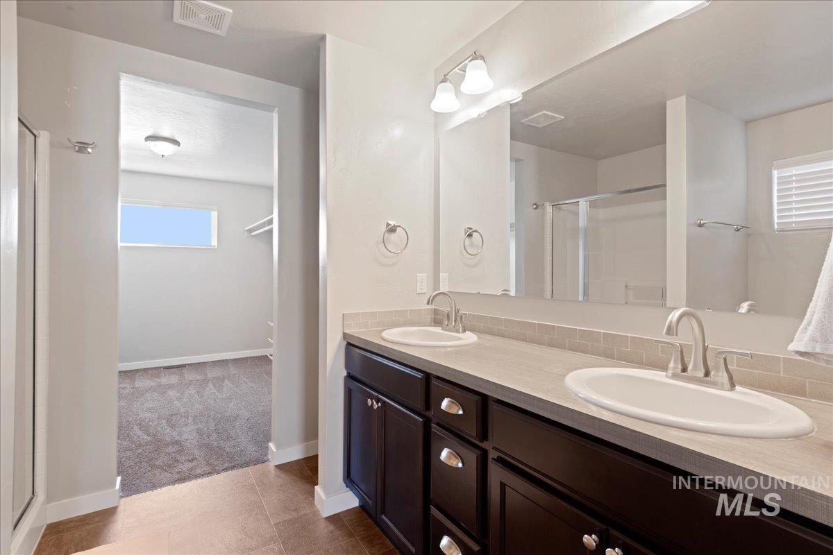 401 East Joshua Tree Drive Meridian, ID 83646 - Photo 19 of 32 Full bathroom with a shower stall and double vanity
