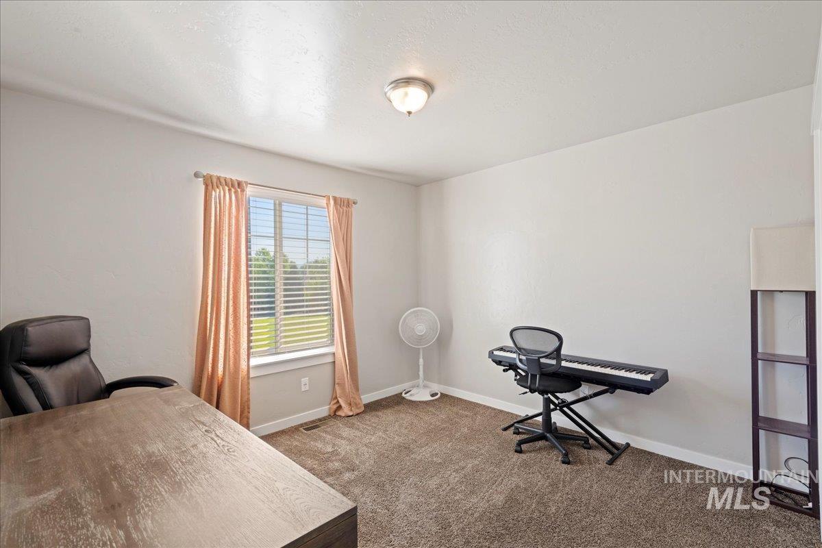 401 East Joshua Tree Drive Meridian, ID 83646 - Photo 22 of 32 Office area with carpet and baseboards