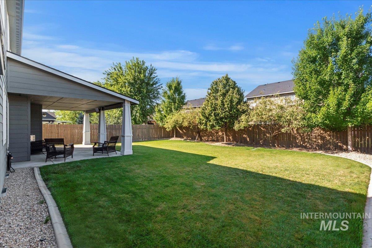 401 East Joshua Tree Drive Meridian, ID 83646 - Photo 30 of 32 Fenced backyard featuring a patio area
