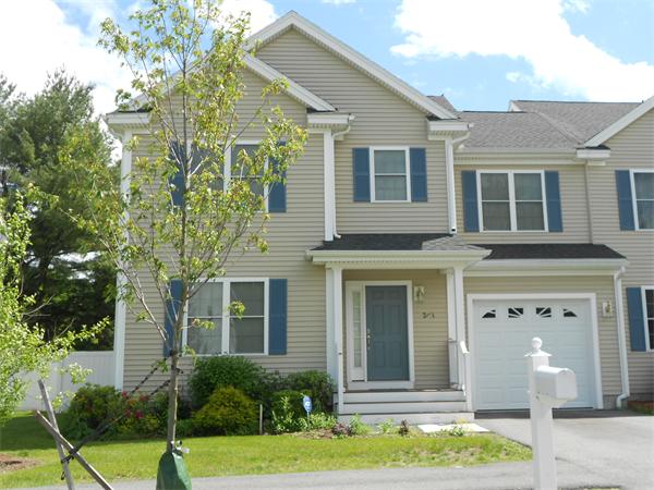 2 Blue Jay Circle, Unit 1 Wakefield, MA 01880 - Photo 1 of 1 a front view of a house with a yard