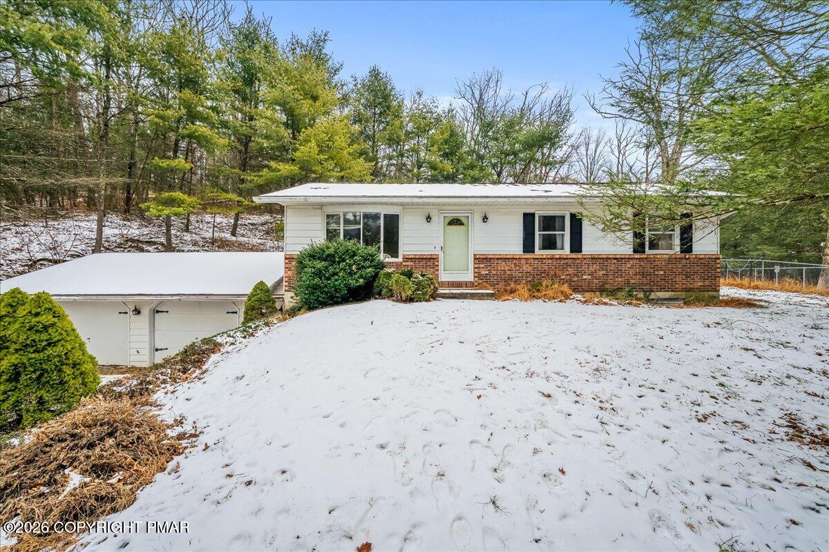 626 Northway Road Linden, PA 17744 - Photo 1 of 28 a front view of a house with a yard and potted plants