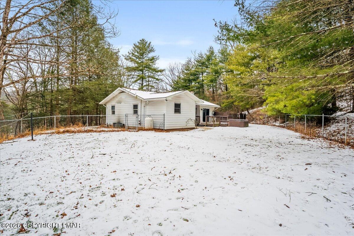 626 Northway Road Linden, PA 17744 - Photo 24 of 28 a white house with a large tree with yard and wooden fence