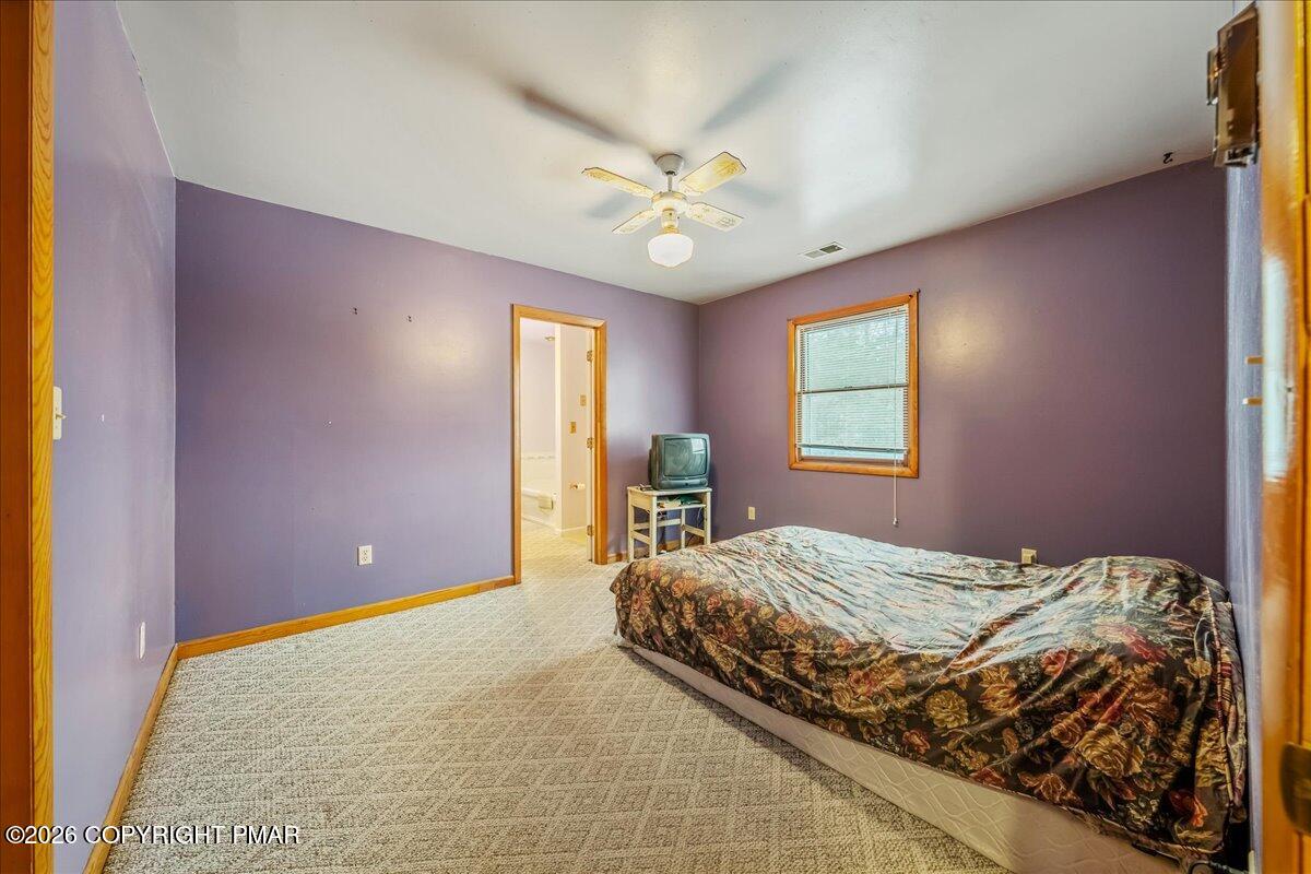 626 Northway Road Linden, PA 17744 - Photo 7 of 28 a bedroom with a bed and a chandelier