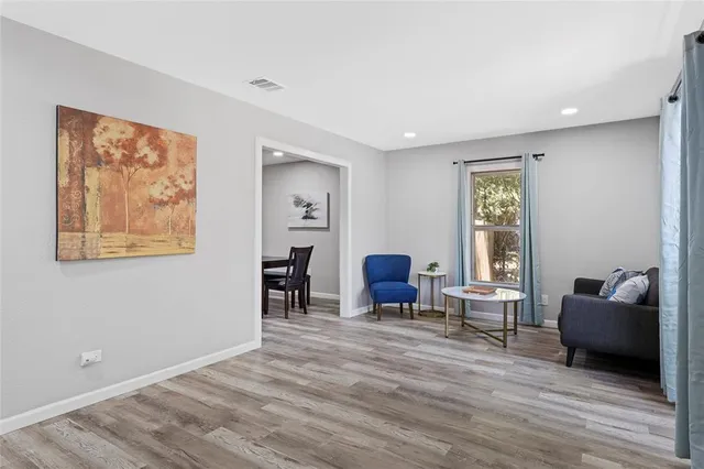 a living room with furniture and a window