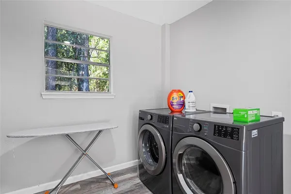 a view of livingroom with washer and dryer