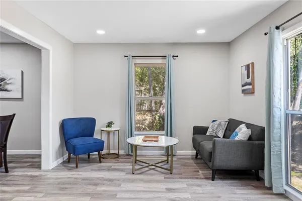 a living room with furniture and a window