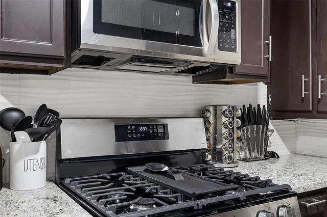 a kitchen with a stove and a microwave