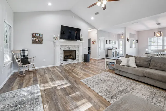a view of a dining room with furniture and wooden floor