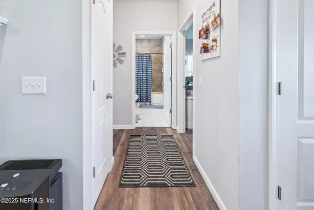 a bedroom with a bed workspace and a window