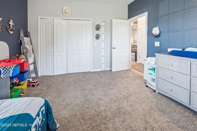 a view of a house with a yard and garage