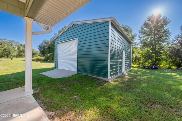 swimming pool view with a seating space