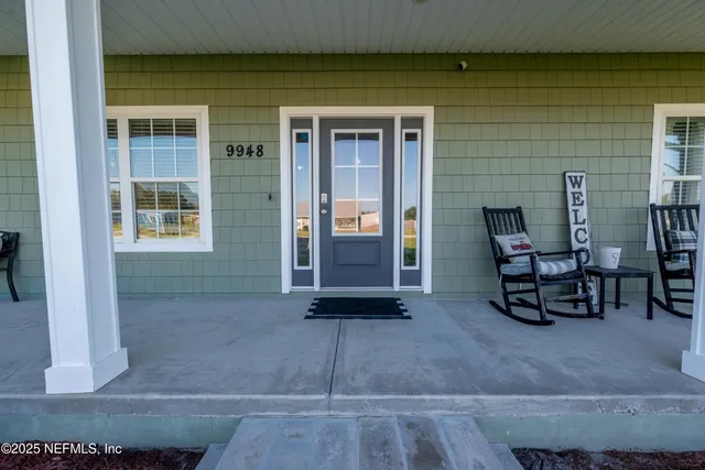 a view of outdoor space with porch and wooden floor